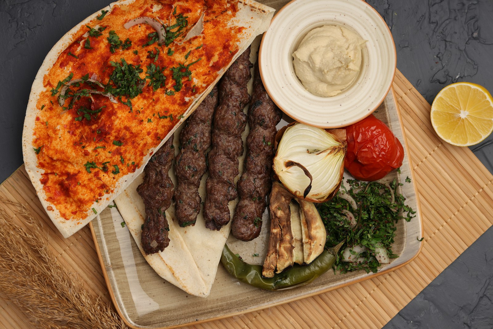 Grilled meat skewers with flatbread and vegetables